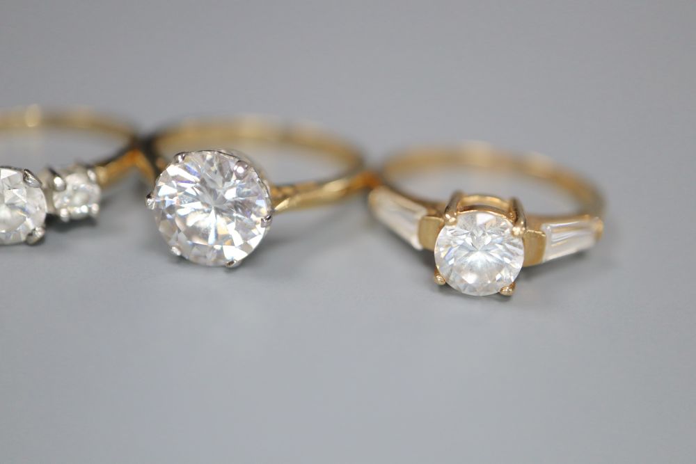 Five assorted modern 14ct gold and CZ set dress rings, gross 13 grams.